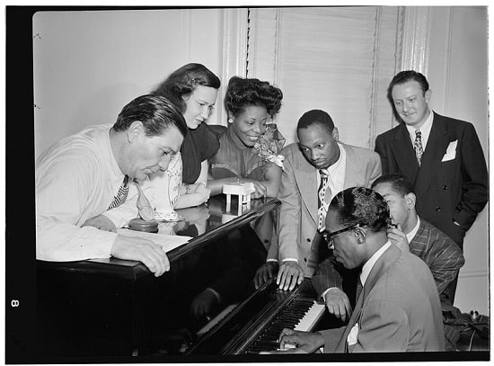 Mary Lou Williams in her apartment with Jack Teagarden, Tadd Dameron, Hank Jones and Dizzy Gillespie